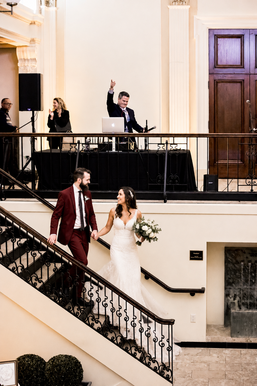 DJ Graeme Ritchie performing above a wedding couple at Providence Public Library